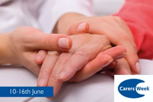 A younger and older lady's hands embracing promoting carers week.