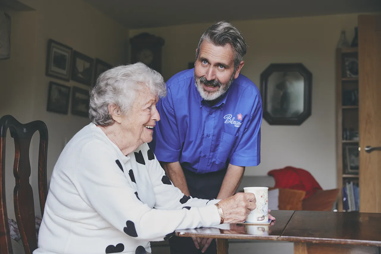 blossom home care carer client chatting