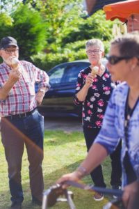 Senior people eat ice cream together.