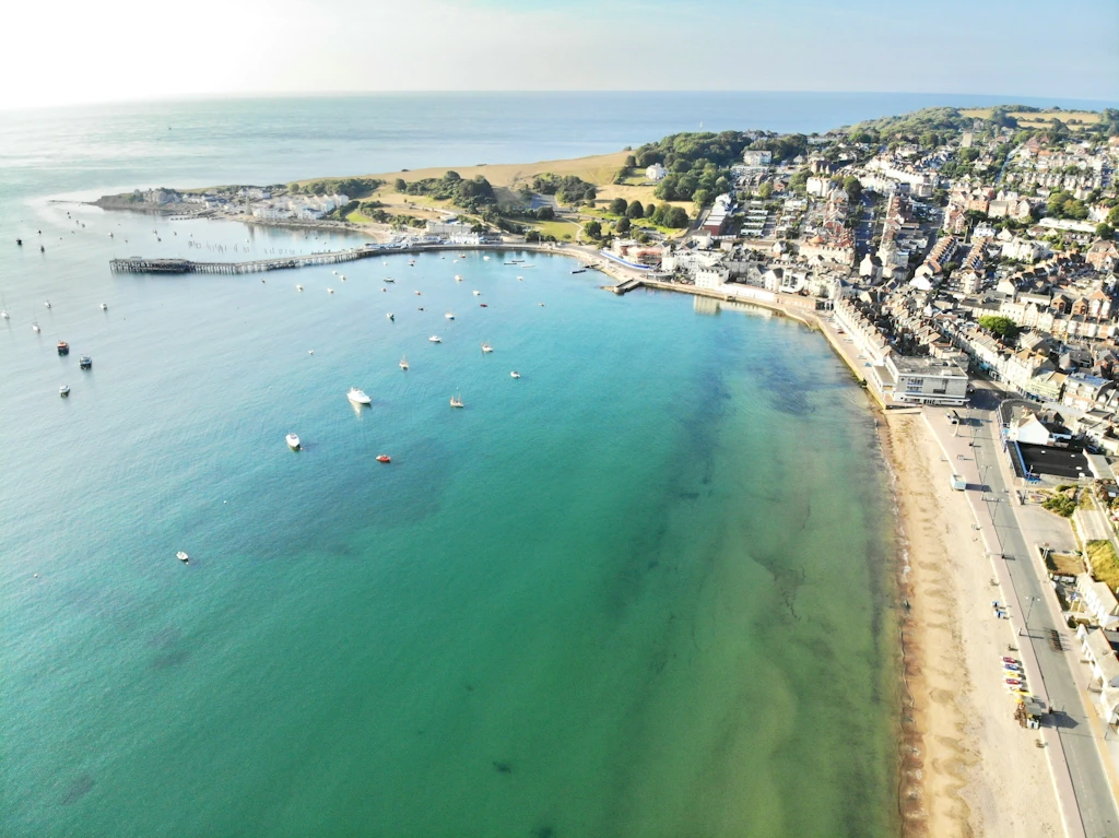 An aerial view of the Dorset coast to represent Blossom Home Care Services.