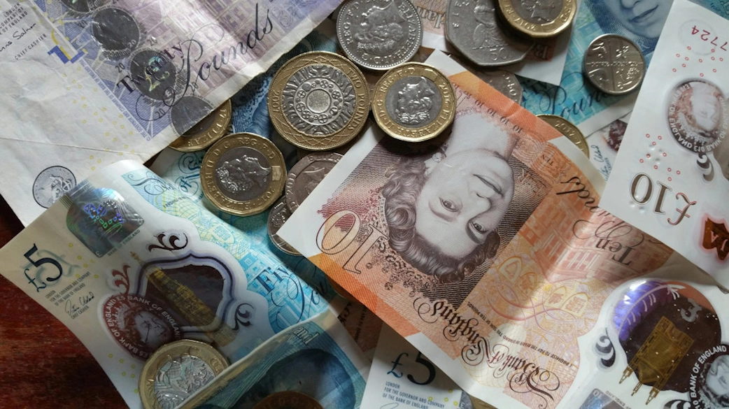 Great British coins and notes, viewed from above.