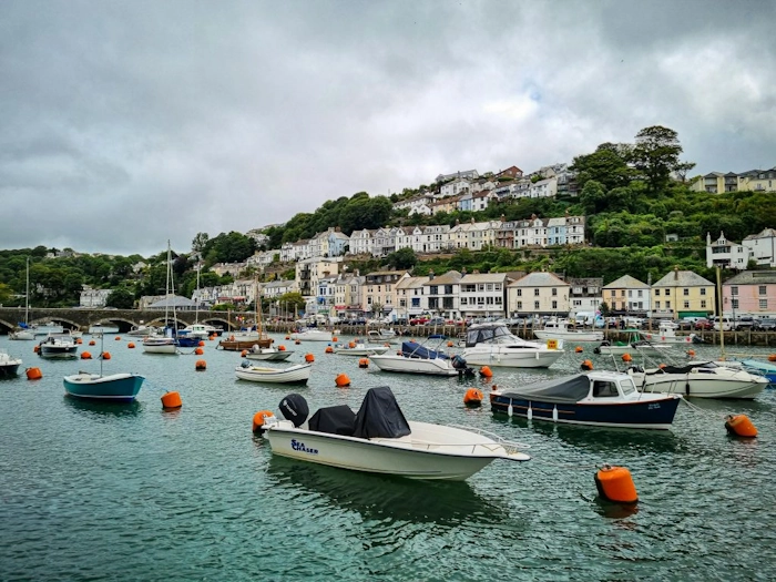 Small town in Cornwall surrounded by the sea and boats.